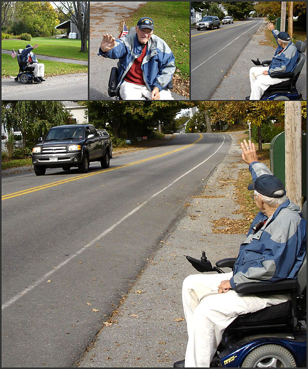 Kert Ingraham doing what he does, waving to passersby from his perch at the edge of 63 Washington St. in Camden (Photos by Chris Wolf)