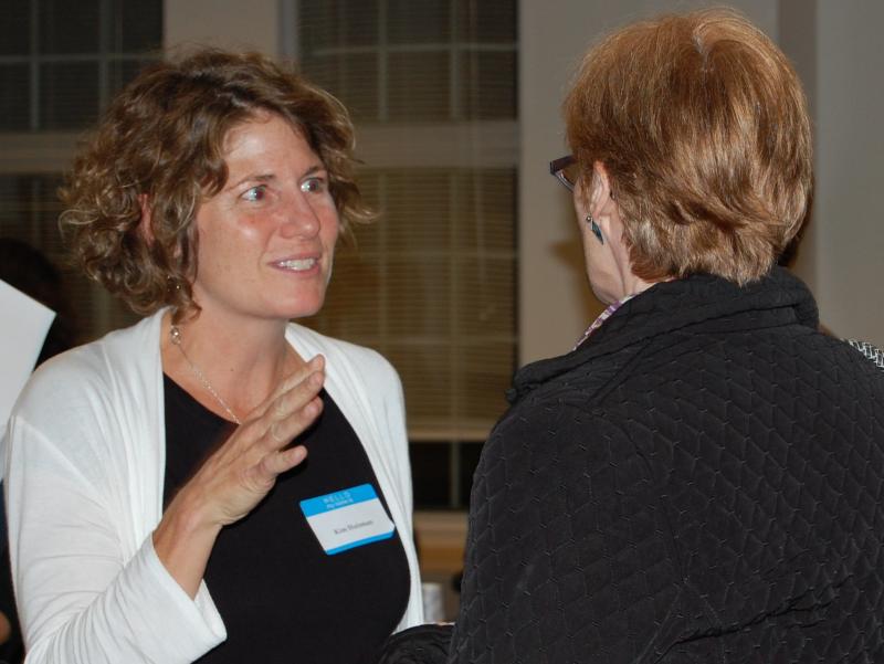 Kim Huisman (left), Associate Professor of Sociology and Coordinator of the Maine Mother-Daughter Project speaks with keynote speaker Lyn Mikel Brown. (Photo by Kathleen Meil)