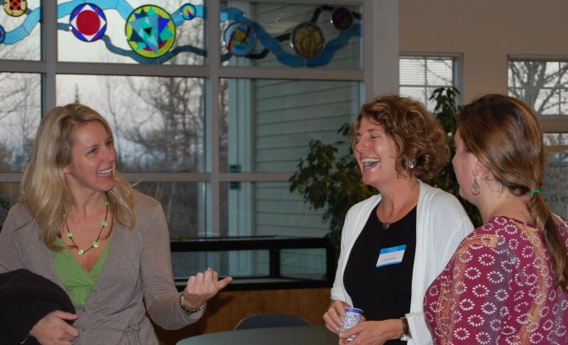 Kim Huisman, Associate Professor of Sociology, UMaine and coordinator of the Maine Mother-Daughter Project speaks with conference participants. (Photo by Kathleen Meil)