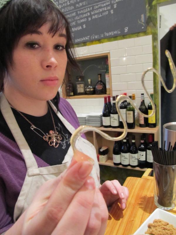 Pastry chef Kiwi Barros holding up a sugar garnish (photo: Kay Stephens)