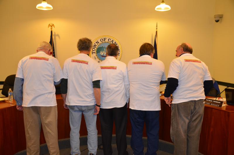Camden Select Board members Tuesday night display the back of the 2013 Toboggan National T-shirts, which recognizes the event venue at the Snow Bowl as 'Tobogganville."