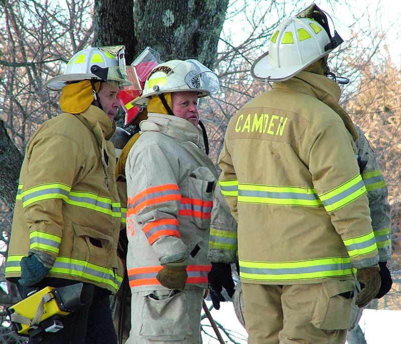 With his white turnout gear, white helmet and orange stripes, Rockport Fire Chief Bruce Woodward is easy to pick out of a crowd. (Photo by Holly S. Edwards)