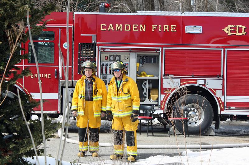 Camden firefighters Galen Todd and Tom Bland man the pumper. (Photo by Holly S. Edwards)