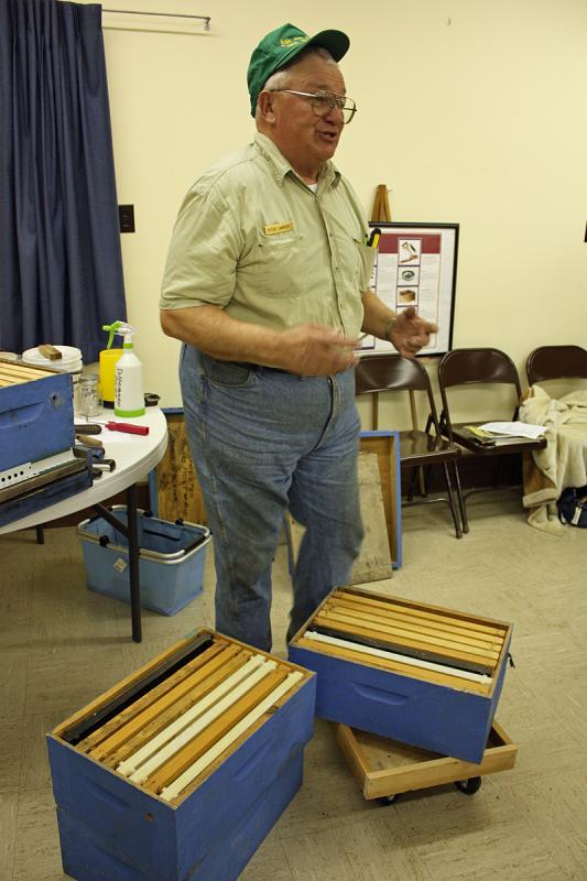 Peter Lammert shows what a hive box looks like with its 10 frames inside. (Photo by Holly S. Edwards)
