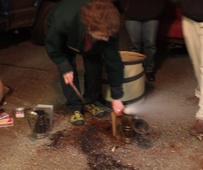 A few puffs of the bellows and we have smoke. (Photo by Holly S. Edwards)