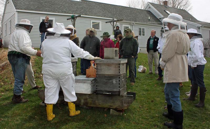The group at Jean Vose's home in Nobleboro. This photo shows that beehives don't have to be far from a home to be safe for the occupants, the key is knowing your bees and how to work safely around them. (Photo by Holly S. Edwards) (Photo by Holly S. Edwards)