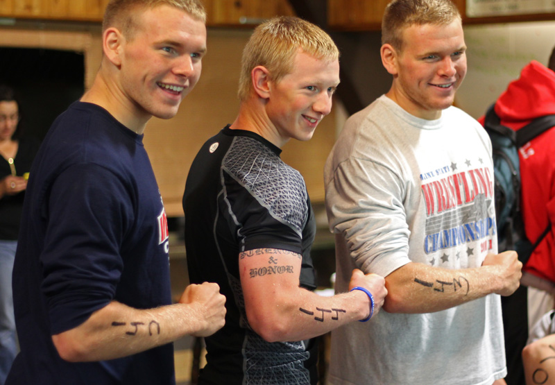 Ryan and Brandon Graffam and Jake Hauprich get their race numbers and are ready to go. (Photo by Bane)