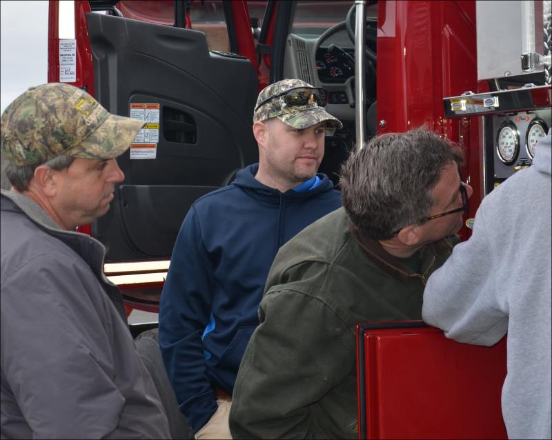 Lincolnville Fire Chief Jason Peasley, center, is Rockport's new fire chief, starting May 20. In this photo, Peasley and members of the Lincolnville Fire Department inspect a new truck that arrived in that town in November 2012. (Photo by Lynda Clancy)
