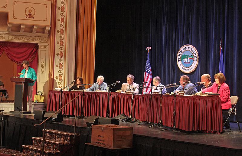 Deborah Dodge moderates the June 12 Camden Town Meeting at the Opera House, with Select Board members and Town Manager Patricia Finnigan under the lights on stage. (Photo by Holly S. Edwards)