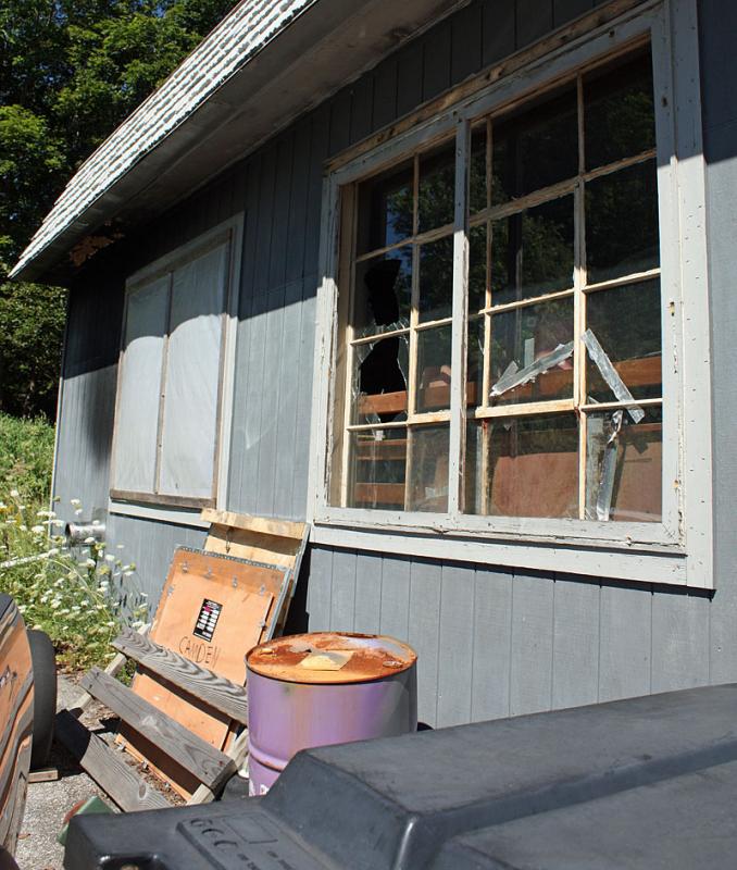 This south window was the next to be hit by a large rock, but it too had bars on it, preventing access. (Photo by Holly S. Edwards)