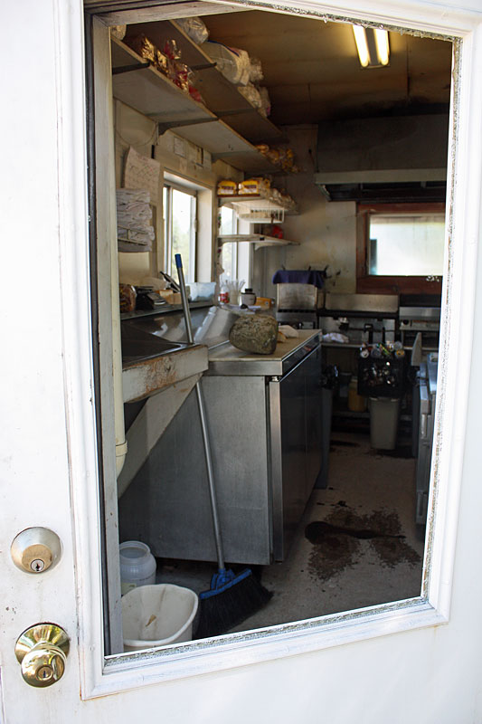 The rock used to break into Scott's Place sits atop a cooler. (Photo by Holly S. Edwards)