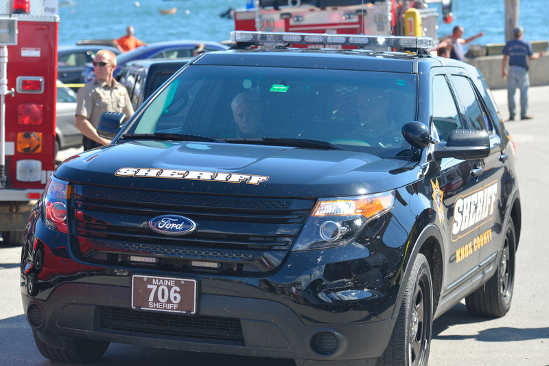Cheryl Torgerson of New York City, driver of the car that killed a 9-year-boy in Port Clyde Sunday afternoon, is driven away from the scene. (Photo by Ron Hawkes)