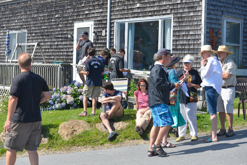 Witnesses and passerby’s gather at the top of the hill on Route 131 in Port Clyde, some waiting to be interviewed by the Knox County Sheriffs Department. (Photo by Ron Hawkes)