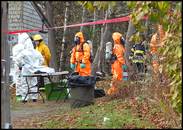 MDEA agents and members of the state DEP’s oil and hazardous material response team at the scene on South Shore Drive in Owls Head Friday. (Photo by Chris Wolf)