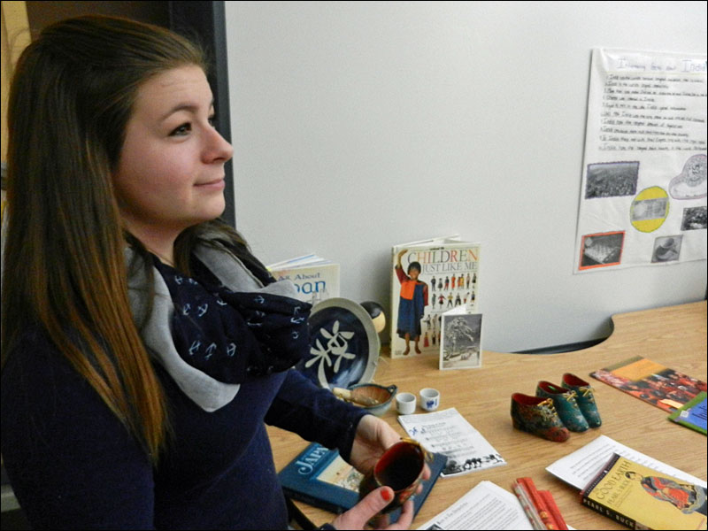 Emma describes what she learned about an ancient Chinese tradition. (Photo by Eva Murray)