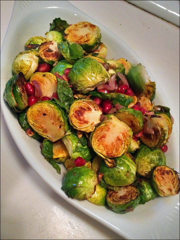 The finished dish, garnished with pomegranate seeds and toasted pumpkin seeds.