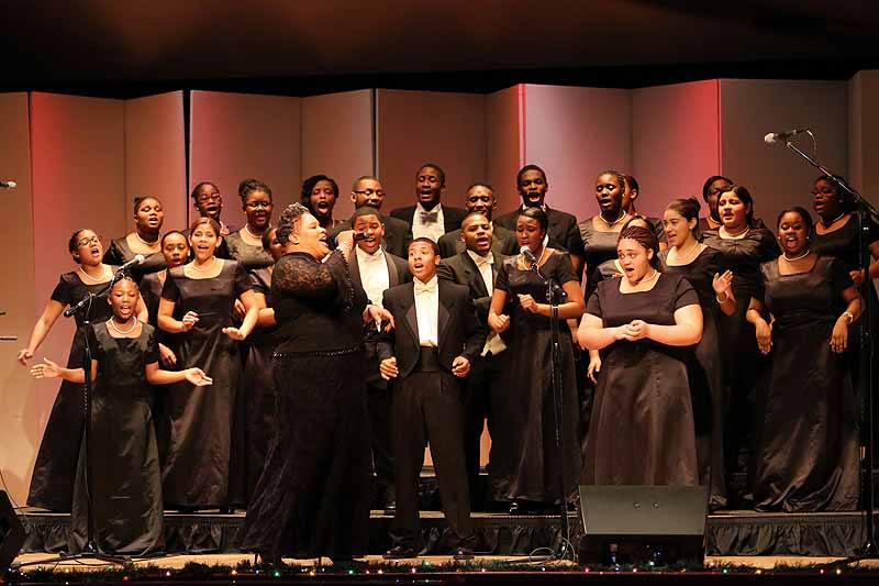 The Rev. Chantel Wright leads her Songs of Solomon Gospel Choir in a lively number at the Rockport Opera House Dec. 14, during Holiday’s on the Harbor. (Photo by Marti Stone)