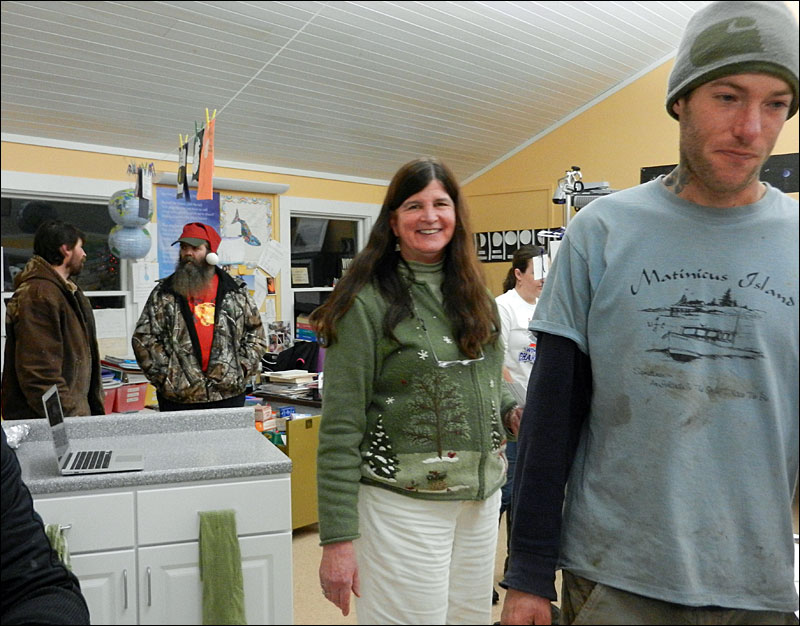 From left, Jeremy Van Dyne, Robert Young, teacher Pam Stock and Jeb Worcester were some of the Islanders attending the school’s open house. (Photo by Eva Murray)