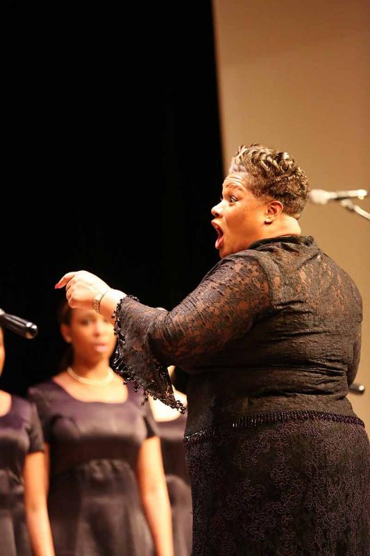 Animated and attention-commanding, the Rev. Chantel Wright directs her Songs of Solomon Gospel Choir with her whole body. (Photo by Marti Stone)