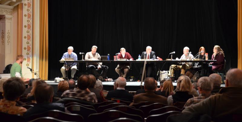 The Camden Planning Board was again on stage at the Camden Opera House Dec. 12 for the last of public informational meetings and public hearings that the board will hold on the Fox Hill ordinance amendment. At the board’s next meeting, conversation will be contained to board itself, or with attorneys, should board members seek clarification on details. At the podium in this photo is Camden resident Tony Pike, who said he he has lived here his whole life. He encouraged the Planning Board to send the amendment proposal on to the Select Board, saying the town needs to attract fulltime work. Fox Hill, he said, would help “families like mine get through the winter and help avoid having to move away.” (Photo by Lynda Clancy)
