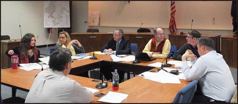 Rockland City councilors and staff, left to right, starting with City Clerk Stuart Sylvester (with his back to the camera), Elisabeth Dickerson, Louise MacLellan-Ruf, City Attorney Kevin Beal, Mayor Larry Pritchett, Acting City Manager Tom Luttrell and Eric Hebert.
