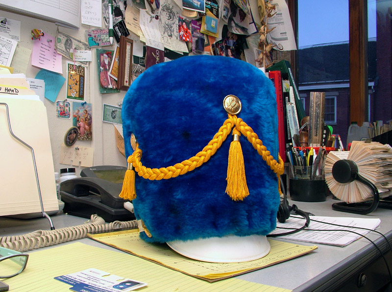 A vintage Belfast Area High School marching band hat in the downtown office of Mike Hurley. The longtime city booster is hoping to spark local interest in an activist marching band, like those featured at the annual Honk! festival. (Photo by Ethan Andrews)