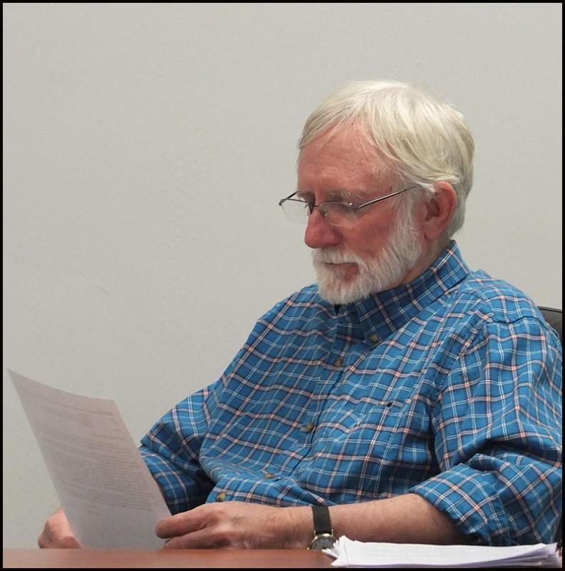Commissioner Rick Parent Jr. reads over the request form the sheriff for training and equipment.