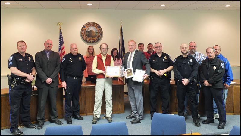 Front row, from left, Rockland Police Sgt. Ken Smith, Detective Sgt. Chris Young and Chief Bruce Broucher, Mayor Larry Pritchett, Officer Lloyd Daniels (ret), Sgt. Anthony Camporiale, Officer Jacob Shirey and Sgt. Don Finnegan; back row, from left, City Councilors Louise MacLellan-Ruf, Elizabeth Dickerson, Eric Hebert and Frank Isganitis, Deputy Police Chief Wally Tower and Officer Scott Solozarno. (Photo by Chris Wolf)