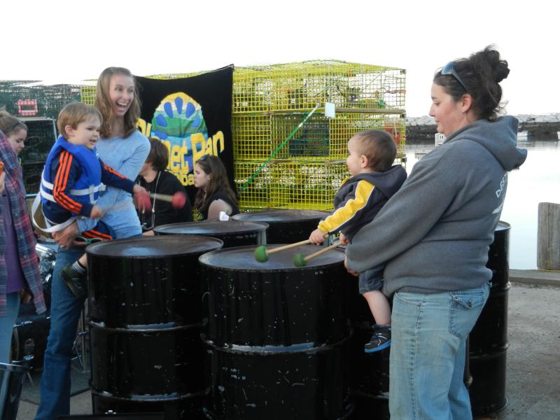 Gavin and Eli play the pans, with a little help from their moms.