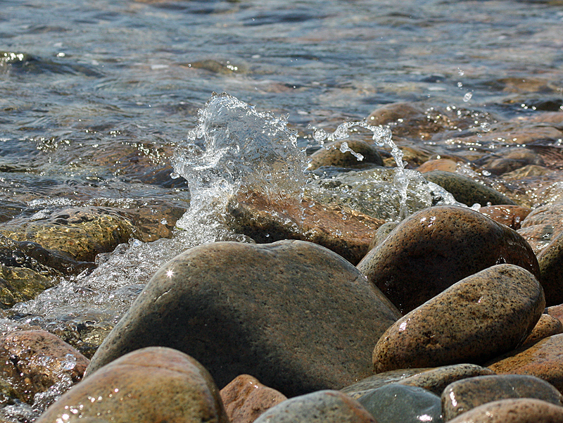 Small waves splash over the rocks on Marshall Island, where guests aboard schooner Mary Day practiced their photography skills. (Photo by Holly S. Edwards)