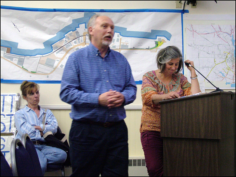 Belfast City Planner Wayne Marshall, center, answers a question posed by a City Council member about current zoning on Seaview Terrace. Behind him, residents of the street, Kathleen Kearns, right, and Laurie Allen wait to address the Council. (Photo by Ethan Andrews)