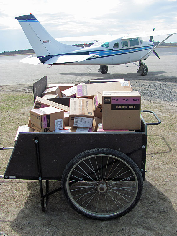Freight ready to go to an island by plane: this time, a large quantity of Legos for a robotics club.
