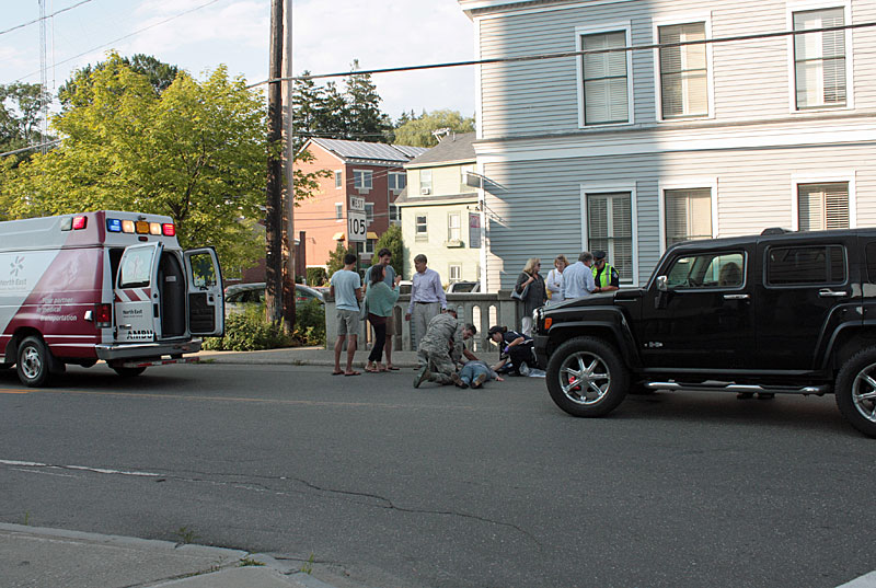 A paramedic from North East Mobile Health Services and others asses the pedestrian’s injuries before preparing her for transport to Pen Bay Medical Center in Rockport. (Photo by Holly S. Edwards)