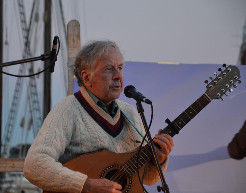 Guitar builder and signer Nikos Apolliiono sings to the crowd. (Photo by Neal Parker)