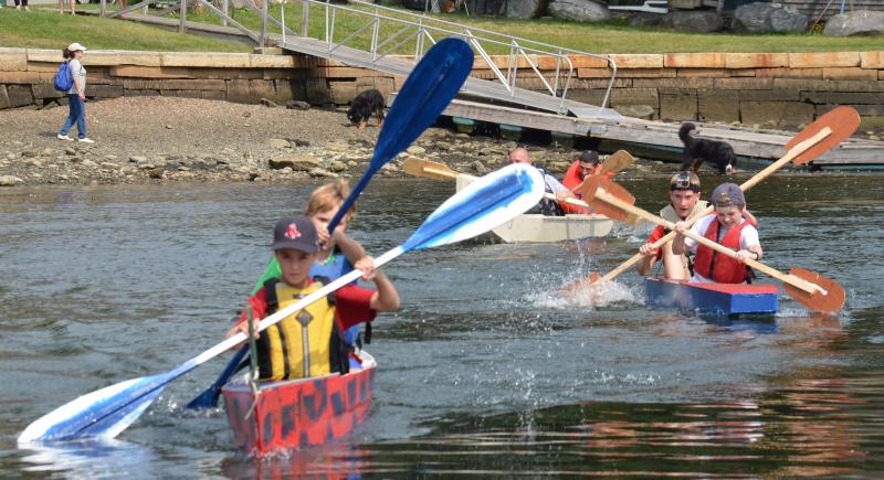 The winners, Aiden Darling and Havana Lyman, approach the finish line — the dock.