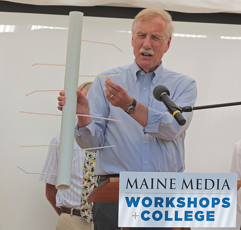 Using the analogy of a poorly designed water system, U.S. Sen. Angus King holds up an example of what Maine’s Internet connectivity looks like today, with one big pipe bringing in water to many tiny pipes that can’t move it quickly into homes and businesses. King was in Rockport Monday afternoon to celebrate the launch of the town’s new broadband Internet connectivity in a limited portion of the village business district. (Photo by Holly S. Edwards)