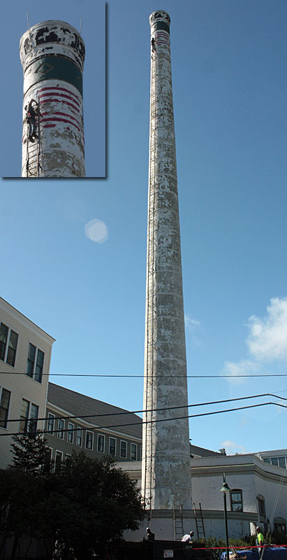 After installing the ladder, scaffolding will begin to appear around and up the length on the Knox Mill smokestack so repairs can get underway this month. (Photo by Holly S. Edwards)