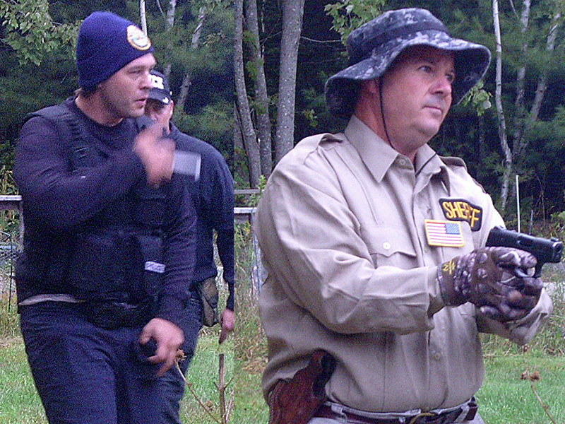 Police have identified the man in the back on the left, whose face is obscured, as Kerry Hurd, 45, of Bangor. A warrant has been issued for his arrest and they are seeking to public’s help in locating him. Hurd’s alleged accomplices, Scott Roberts, left, and his brother, Jeffrey Hurd, right turned themselves into the Waldo County Jail in Belfast Oct. 1 after learning they had been identified and arrest warrants had been issued. Roberts and Jeffrey Hurd live in Glenburn. (Courtesy Maine State Police)