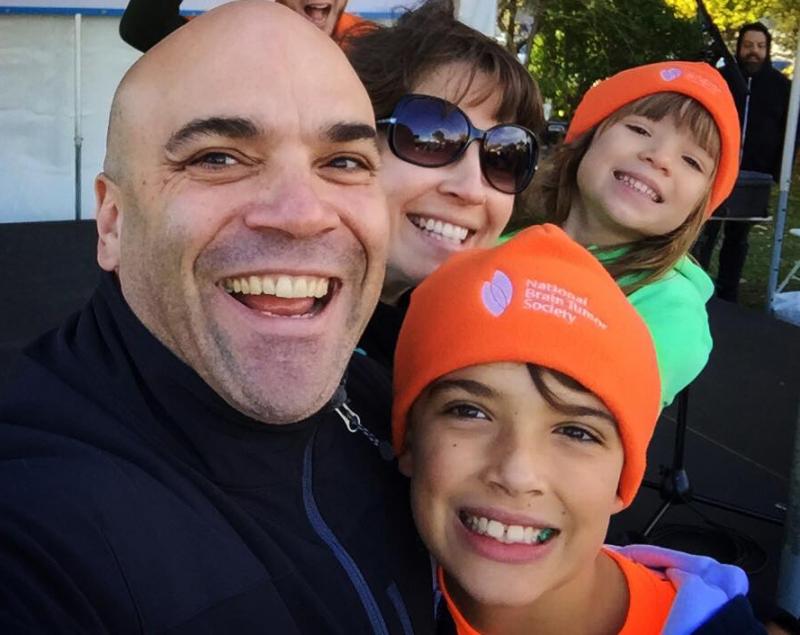 This photo of the Smith family (Billy, Heather, Will and Olivia) participating in the National Brain Tumor Society’s Boston Brain Tumor Walk Oct. 26, prompted 10-year-old Jacob Murray to help them raise money by selling cupcakes with brains on them at his mom’s shop in Rockport. (Courtesy William ‘Billy’ Smith/Facebook)
