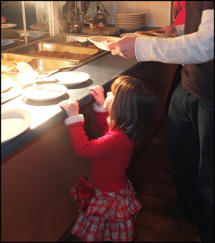 Small does not help you look over the counter, but with Dad’s help, the job gets done.