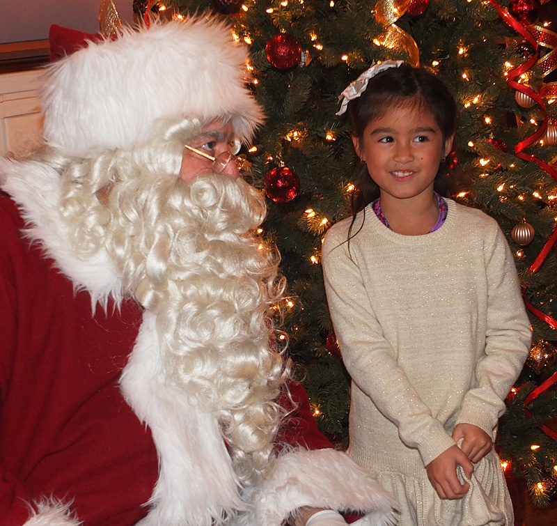Local celebrity Xuan-mai Ipolito poses with Santa,