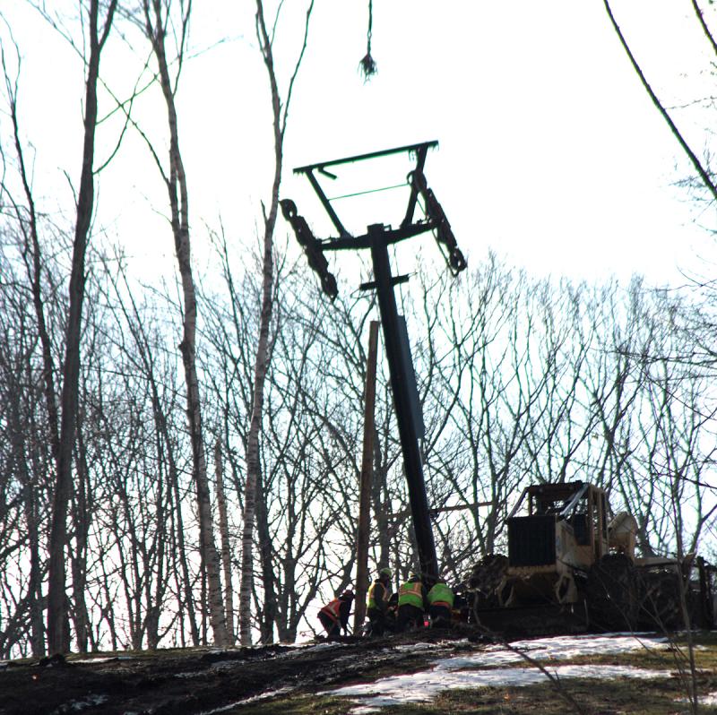 More than twice, this tower, the third one, wavered on the footing and drifted off, eventually bending one bolt before it could be secured into place more firmly, causing its installation to be aborted Monday. (Photo by Holly S. Edwards)