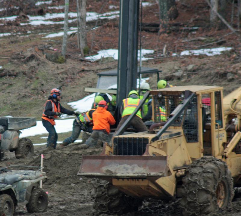 Over and over, the dance of the two ground crews and the helicopter continued Monday, until 14 towers were in place. Tuesday, the remaining nine towers, and a few extraneous pieces of equipment will need to be moved before the helicopter heads back home. (Photo by Holly S. Edwards)
