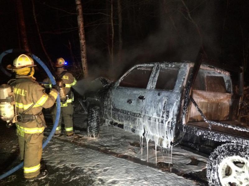Lincolnville firefighters use foam to put out the fast-moving fire that consumed with 2001 Dodge Ram pickup truck Saturday night. (Courtesy Johnny Tofani)