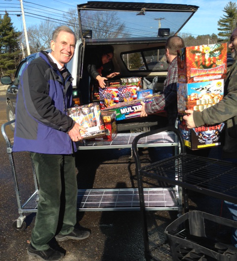 Charlton Ames loads fireworks into the back of the van in Wiscasset. Destination: Rockport Harbor, Dec. 13. (Photo courtesy Eleanor Ames)