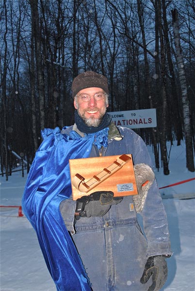 Jim Jefferson, captain of #38 Two Wingnuts, among about 10 other teams, pick up a trophy for 2-Person Second Place. (Photo by Dave Ridley)
