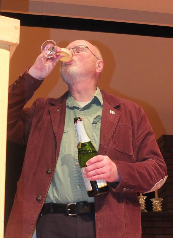 Select Board Chairman Bill Chapman celebrates with the uncorking of champagne (cider, really)