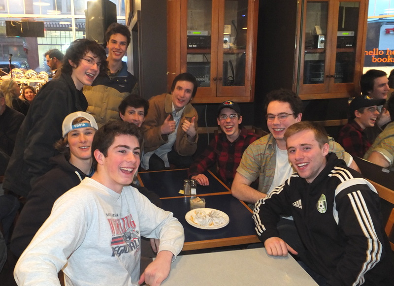 A group of Camden students share their last slice of TC pizza.