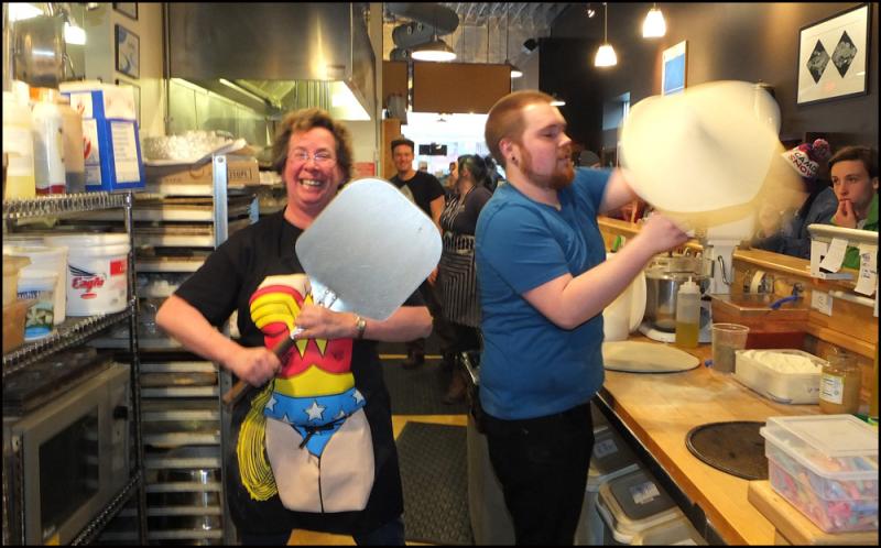 Sarah Vokey and Jake Withee man the hectic pizza line at Rock City Cafe for the Thorndike Creamery Wake. (Photos by Chris Wolf)