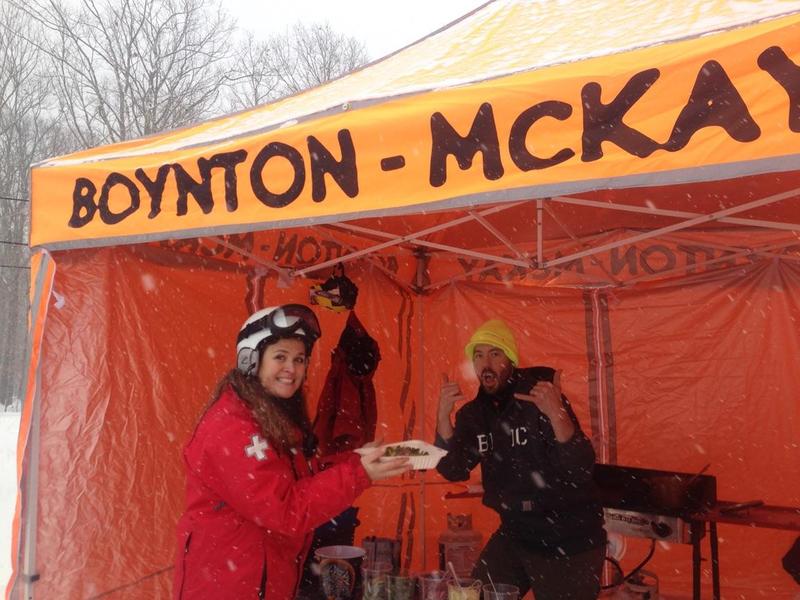 One of Brian Beggarly’s first customers, Snow Bowl Ski Patroller Christine Nathan, enjoys the mid-mountain debut of Cold Toes Tacos at the Camden Snow Bowl. (Photo by Lynda Clancy)